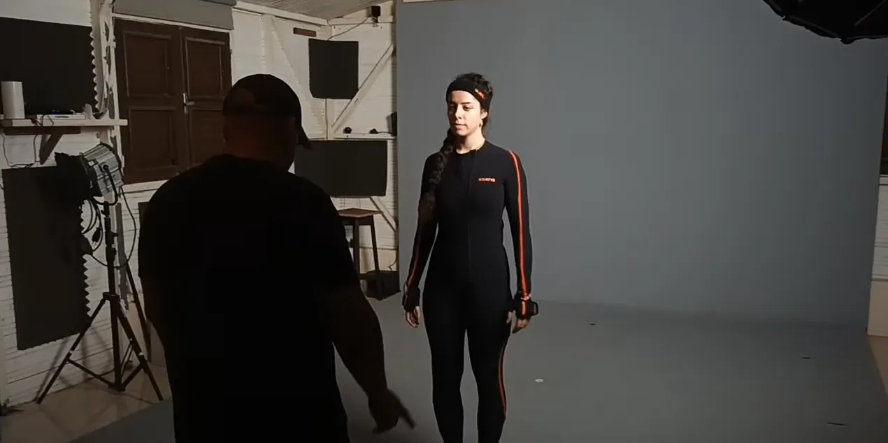 Directing a performer in a motion capture suit in the studio