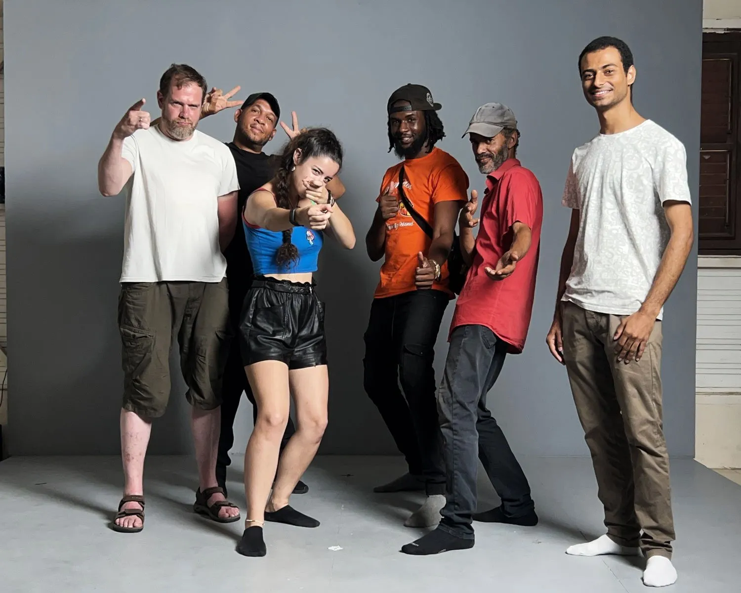 Group of performers gathered in the studio before the session